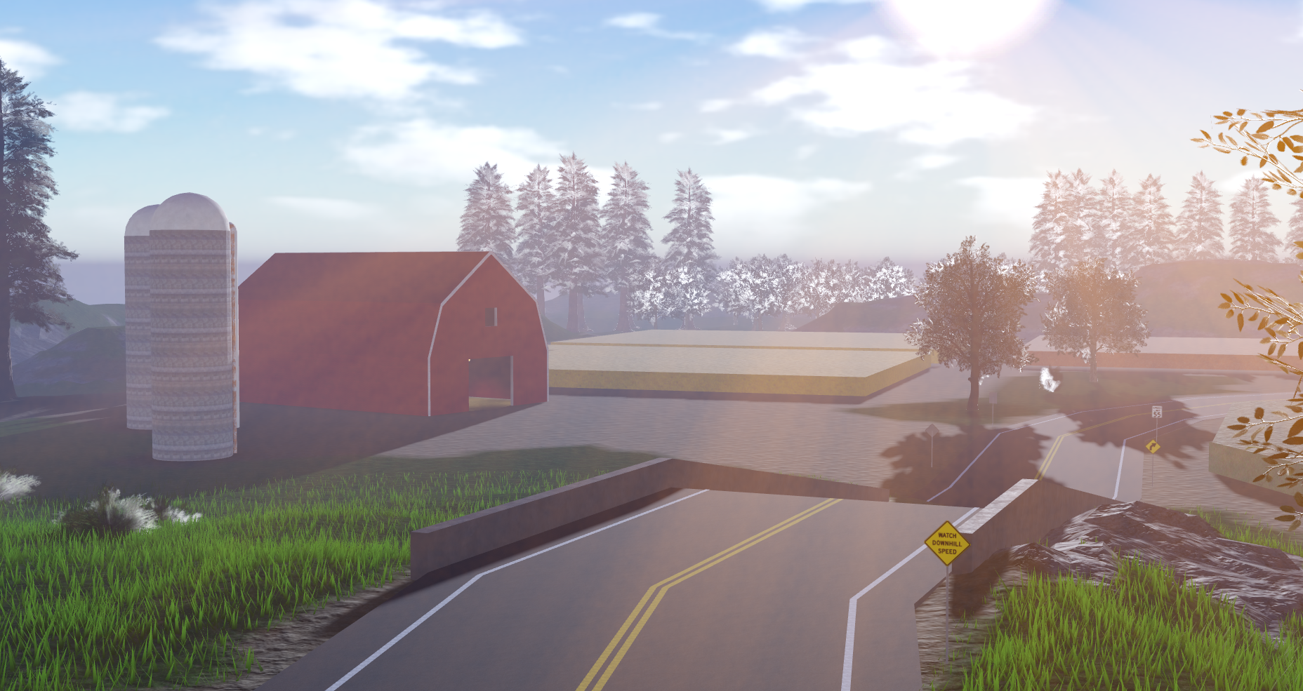 A farm and barn during sunrise
